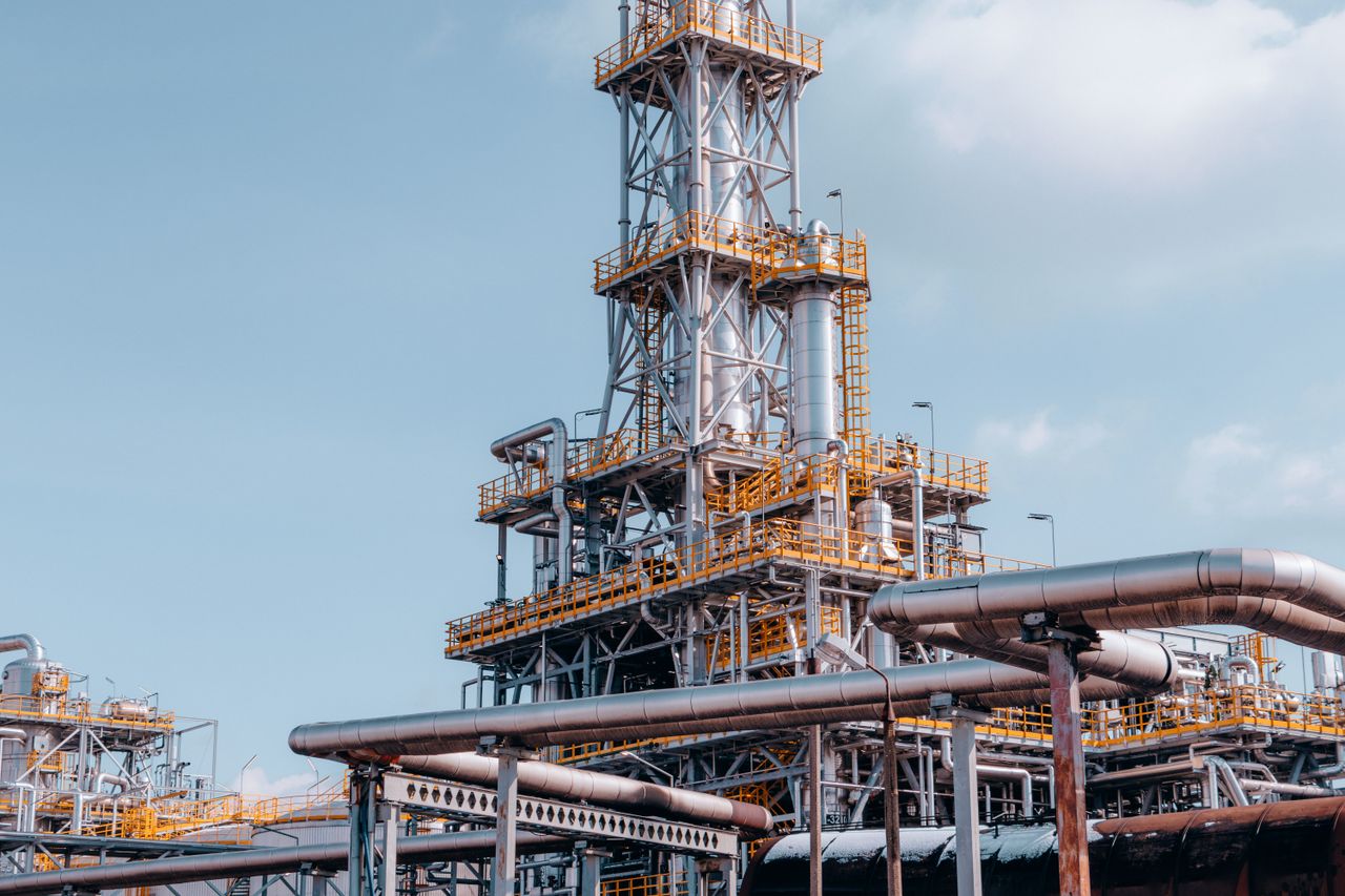 Home View of a large oil refinery plant with intricate pipelines in Trzebinia, Poland.